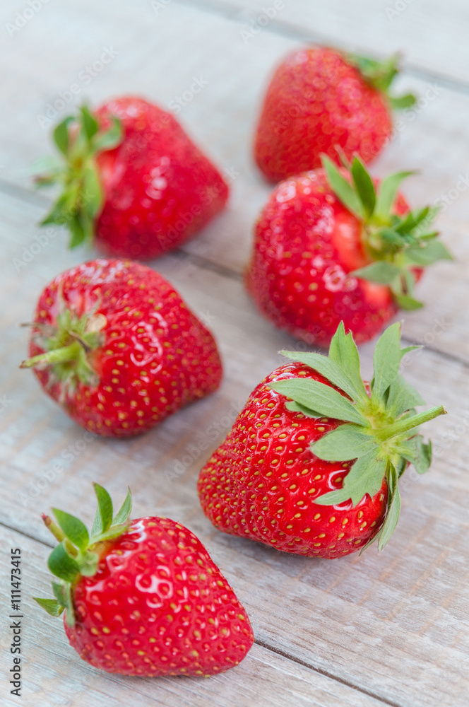 Fresh strawberries on wooden table Fresh strawberries on wooden table