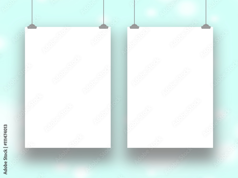Close-up of two blank frames hanged by clips against aqua out of focus abstract background Close-up of two blank frames hanged by clips against aqua out of focus abstract background