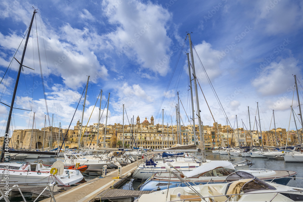Yacht marina at Birgu with blue sky and clouds near Valletta - Malta