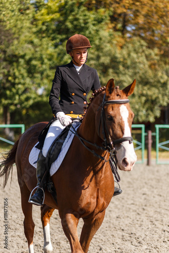 Young teenage girl riding horse. Equestrian sport
