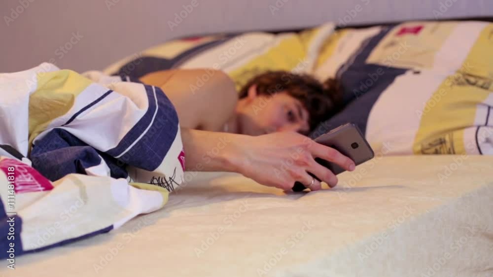 Man in Bed Wakes Up from a Phone Man in Bed Wakes Up from a Phone