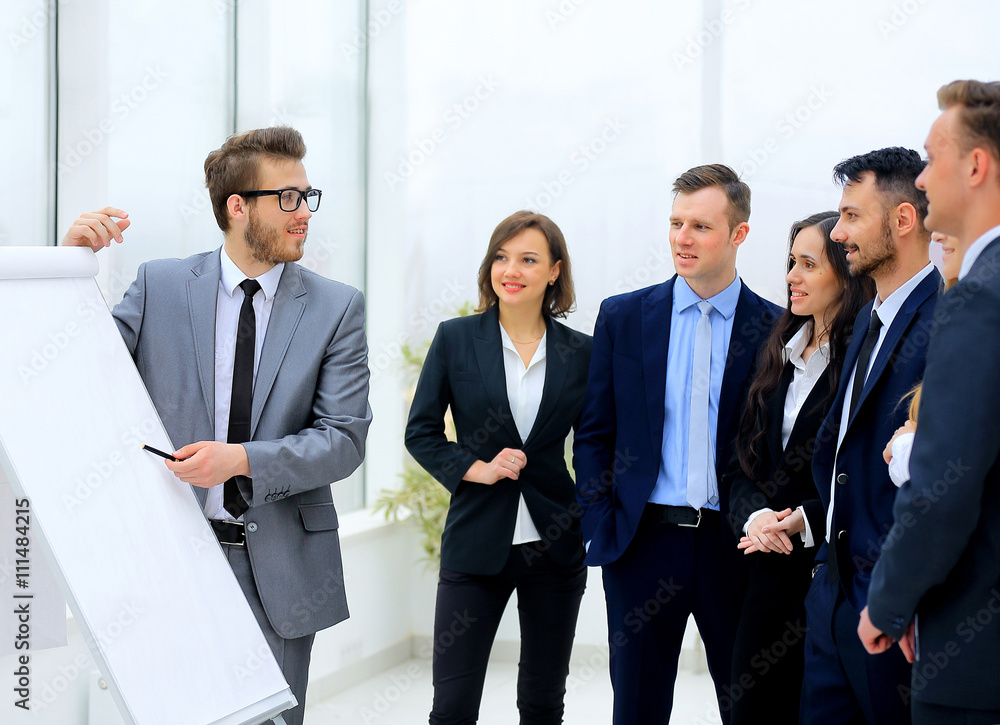 businessman discussing a new business project with the members of his team businessman discussing a new business project with the members of his team