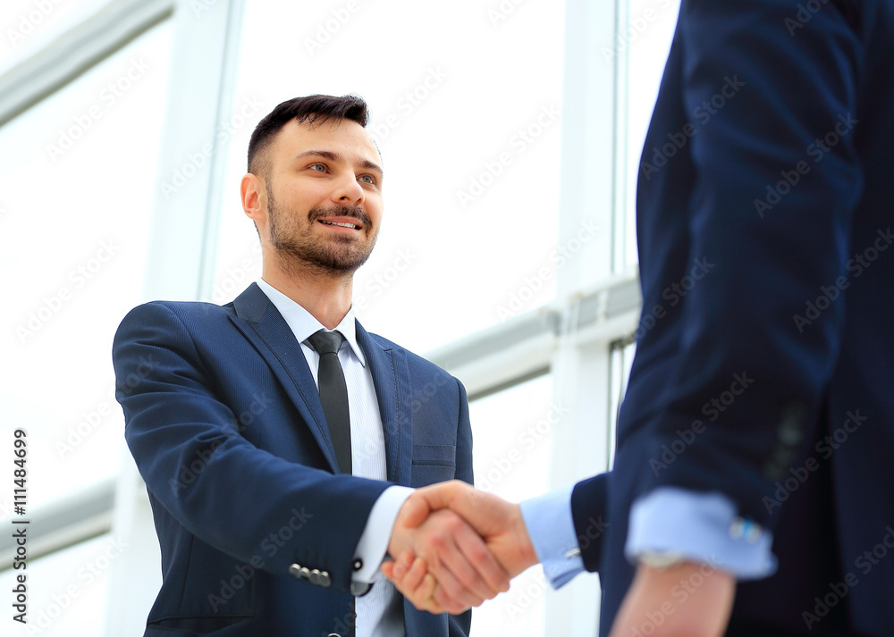 handshake of two businessmen in office handshake of two businessmen in office