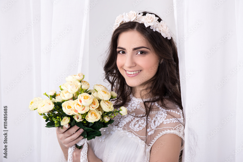 portrait of young beautiful happy bride in white dress with flow portrait of young beautiful happy bride in white dress with flow
