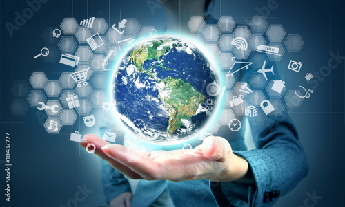 Modern echnology in hand.  Elements this image furnished by NASA