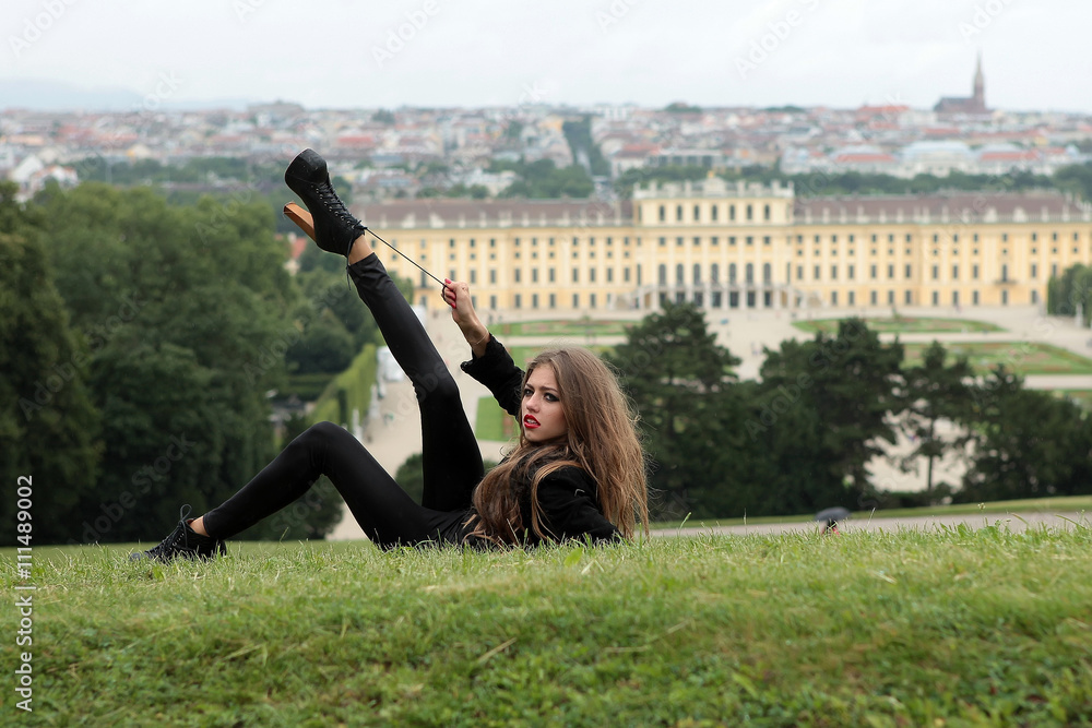 Fototapeta premium Stylish young girl on grass