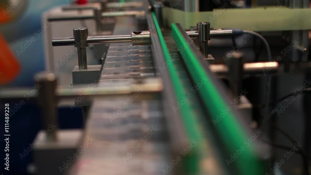 Medical test tubes on a conveyor belt Medical test tubes on a conveyor belt