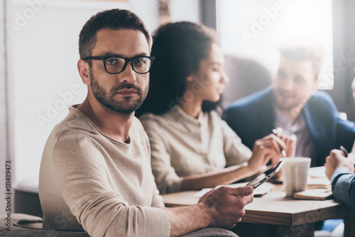 Working with his business team. 