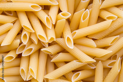 Cuadro en lienzo Italian macaroni pasta full background.