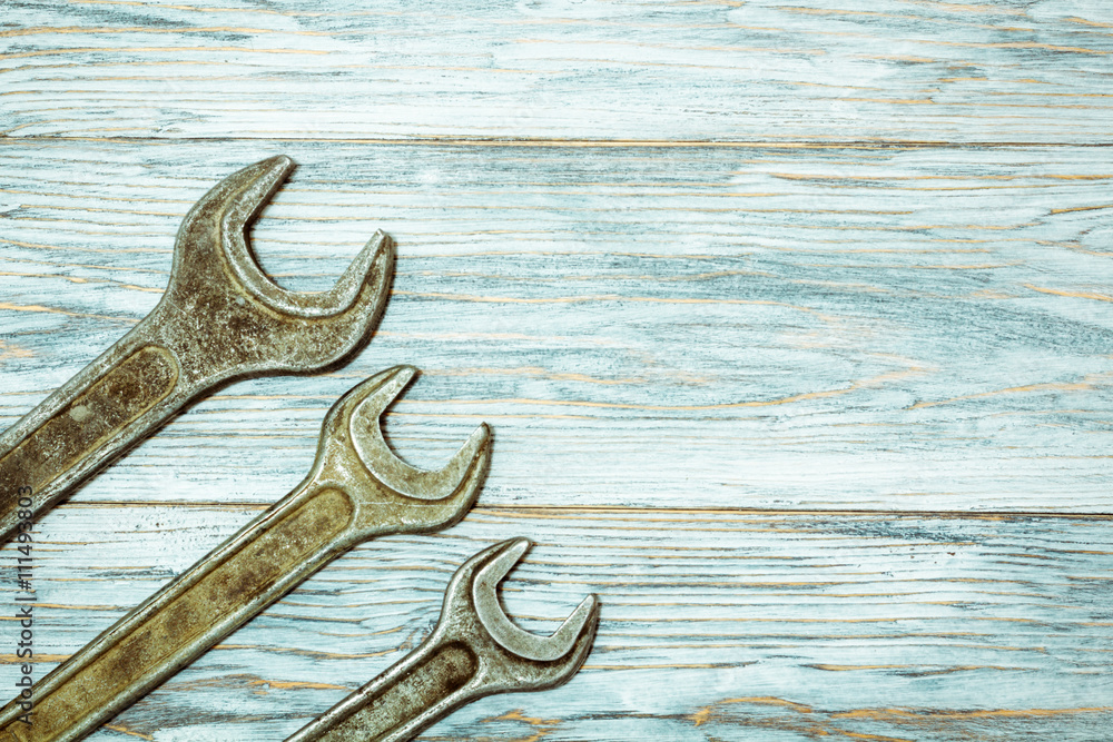 flat lay: wrench on old boards flat lay: wrench on old boards