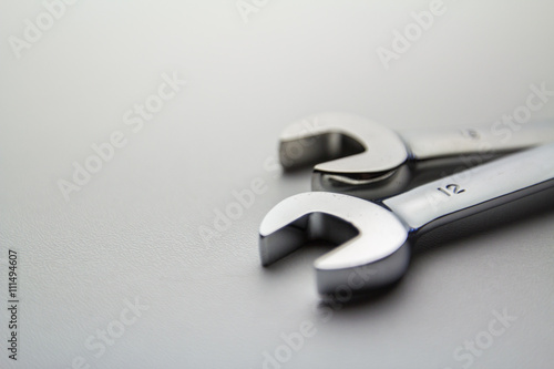 Pair of wrenches on a white surface