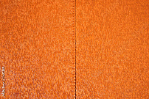 Obraz na plátně Orange leather texture. Leather stitched fabric