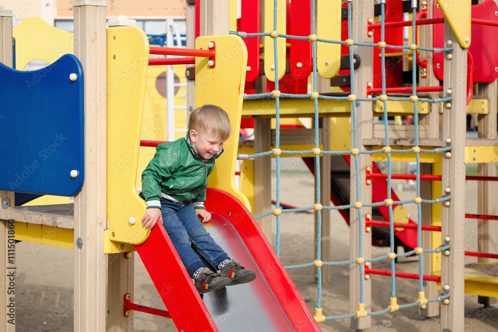 children play on the playground. early spring