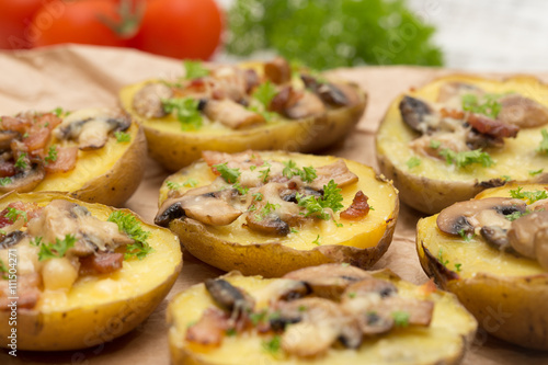 baked potato with mushrooms and bacon with cheese.