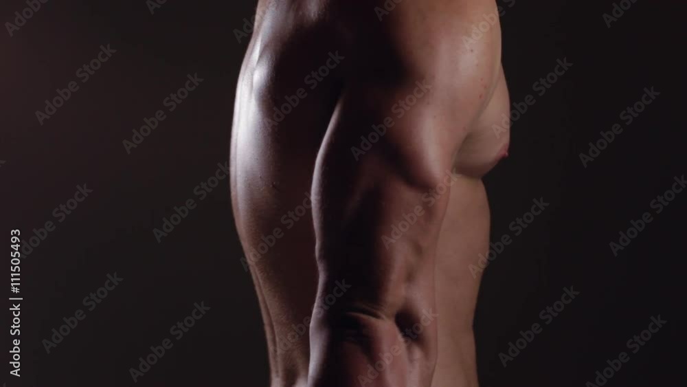 Brutal guy showing his muscles. Triceps. Graded version Brutal guy showing his muscles. Triceps. Graded version