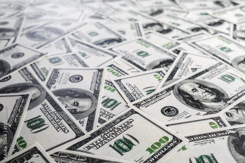 Fake money background. Business background. One hundred dollar bills. Shallow depth of field. Selective focus. Fake money background. Business background. One hundred dollar bills. Shallow depth of field. Selective focus.