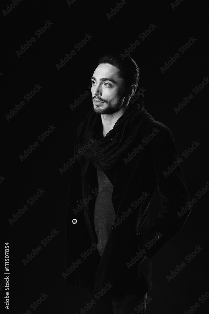 Fototapeta premium Portrait of beautiful sexy man in the studio. black and white.