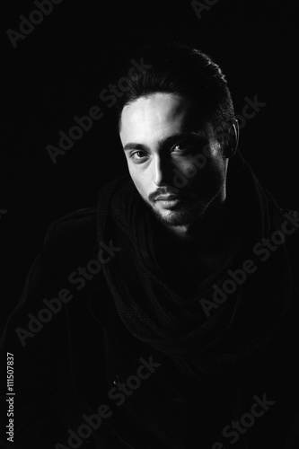 Portrait of beautiful sexy man in the studio. black and white.