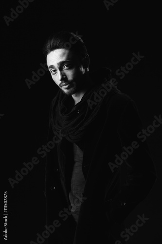 Portrait of beautiful sexy man in the studio. black and white.
