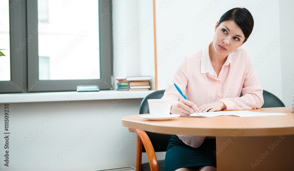 wonam work with papers in office room. wonam work with papers in office room.