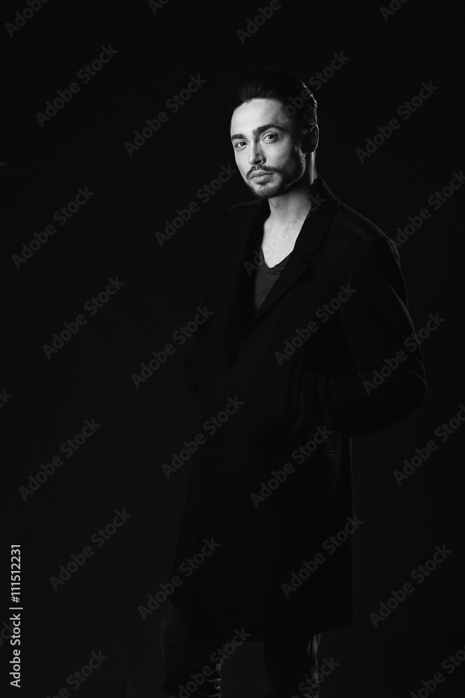 Fototapeta premium Portrait of beautiful sexy man in the studio. black and white.