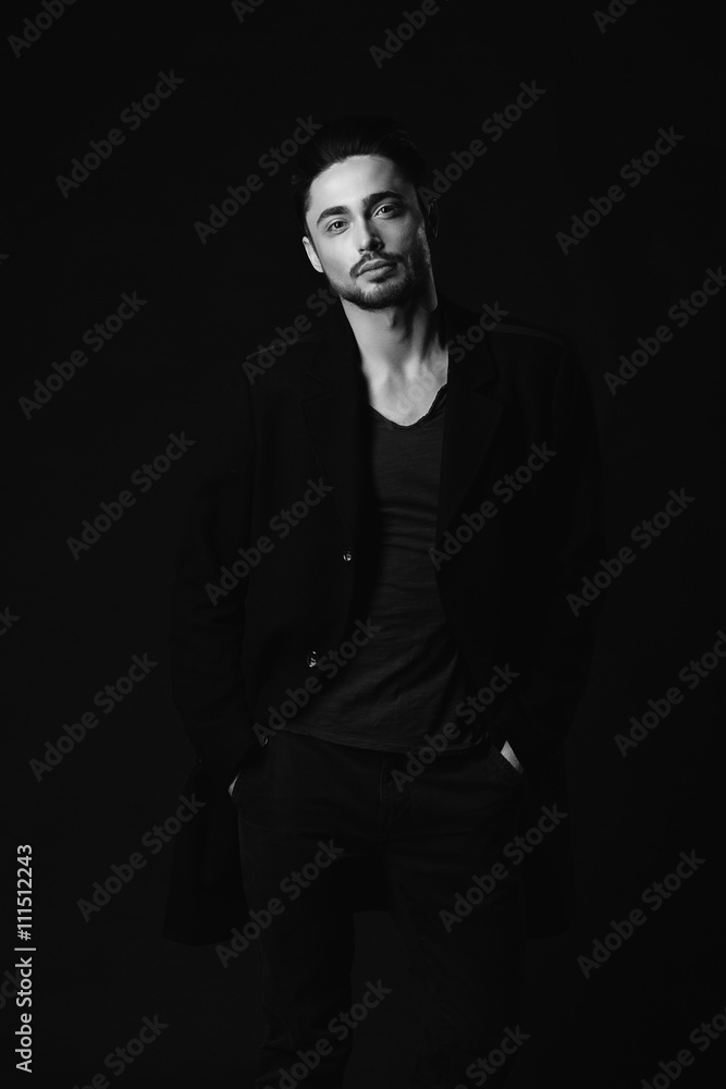 Portrait of beautiful sexy man in the studio. black and white. Portrait of beautiful sexy man in the studio. black and white.