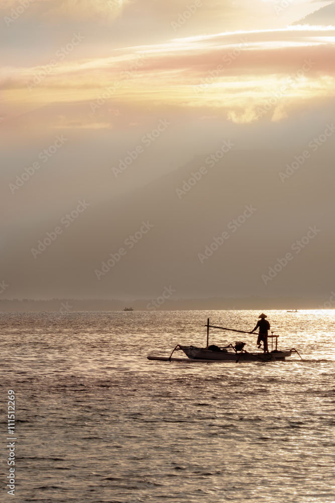 The fisherman boat in the sea in the morning near Rinjani volcano, lombok, indonesia