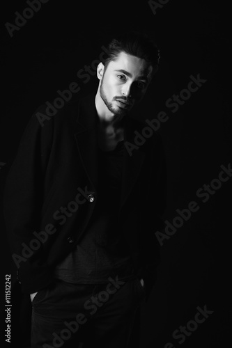 Portrait of beautiful sexy man in the studio. black and white.