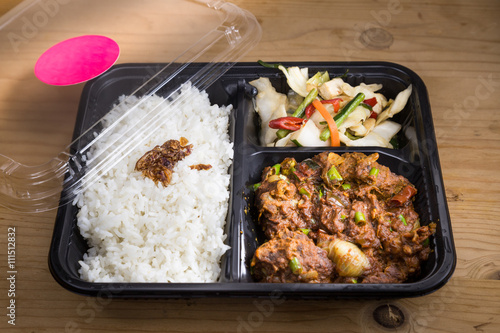 Convenient take-away meal box with rice, meat and vegetable