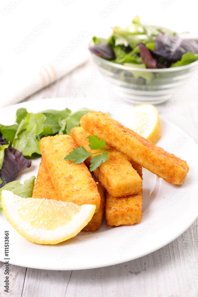 fish sticks with lemon and salad fish sticks with lemon and salad