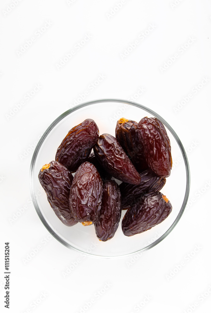 Bowl of dried dates isolated on white background Bowl of dried dates isolated on white background