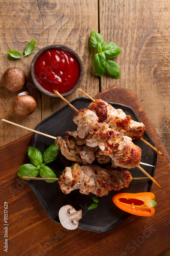 Grilled meat (kebab) with vegetables and  sauce