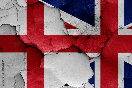 flags of England and UK painted on cracked wall