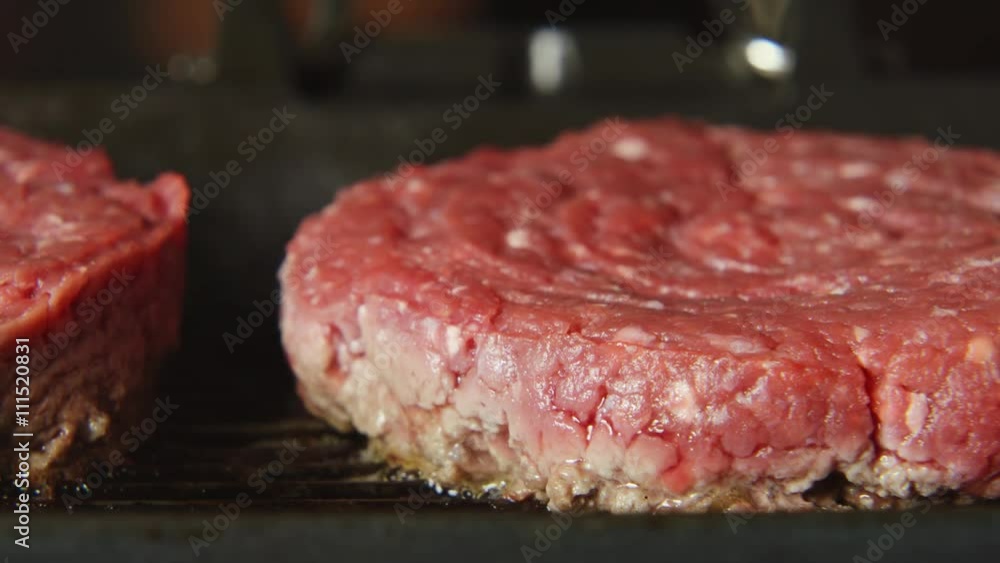 CLOSE UP: A beefsteak on a grill CLOSE UP: A beefsteak on a grill