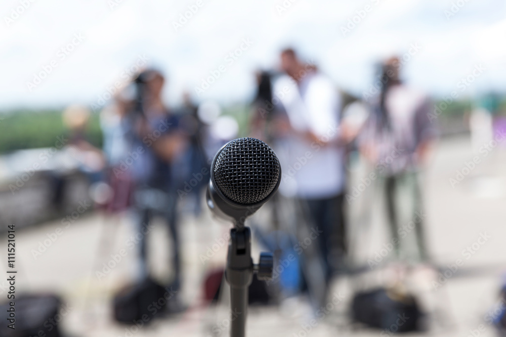 Microphone. News conference. Microphone. News conference.