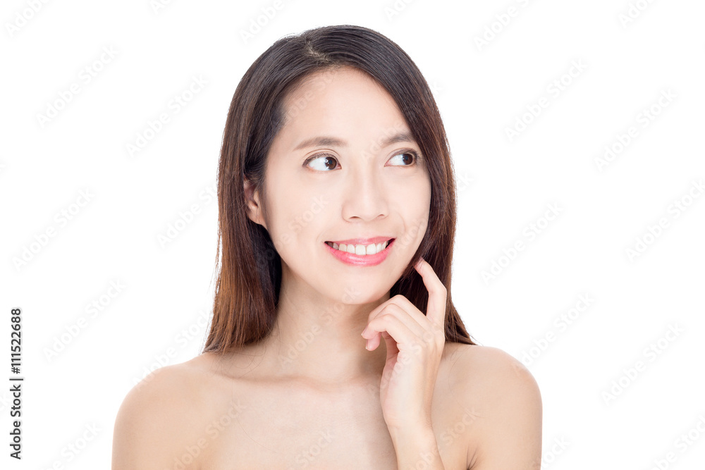 Asian woman with perfect skin and looking away
