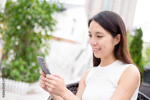 Free Download Woman use of cellphone at outdoor - GFXLoad