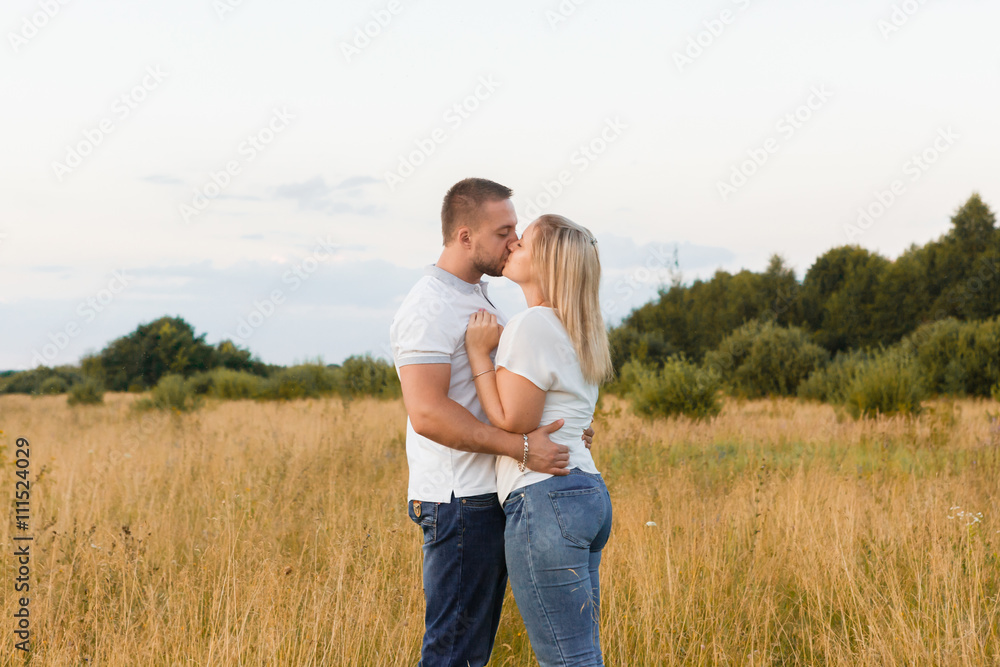 Couple in love in a field of grass Couple in love in a field of grass