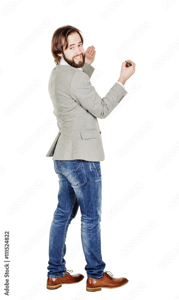 Rear or back view full body picture of man writing something Rear or back view full body picture of man writing something