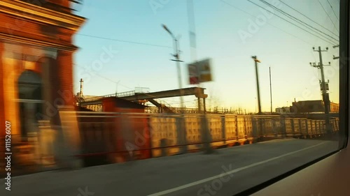 landscape outside the window by during train trip at spring day photo