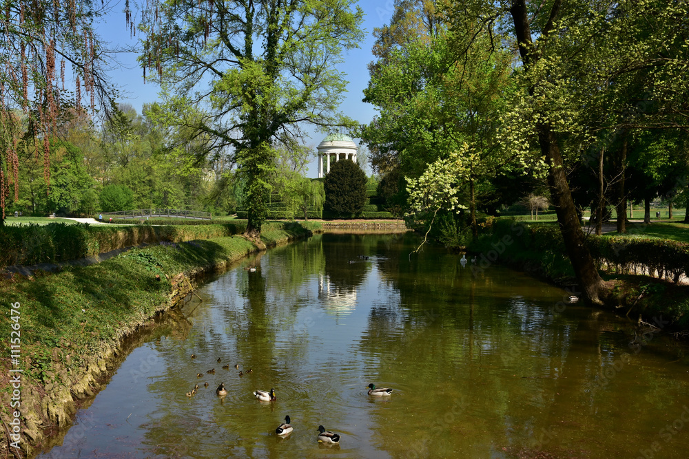 The small lake inside Querini public park in the center of Vicenza, with neoclassical temple in the background