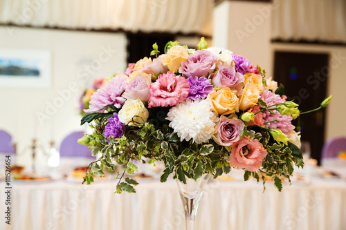 Fototapeta Naklejka Na Ścianę i Meble -  Wedding flower composition for guests tables