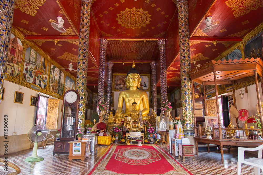 Golden buddha statue at Temple Phra That Hariphunchai in Lamphun, Province Lamphun, Thailand.
