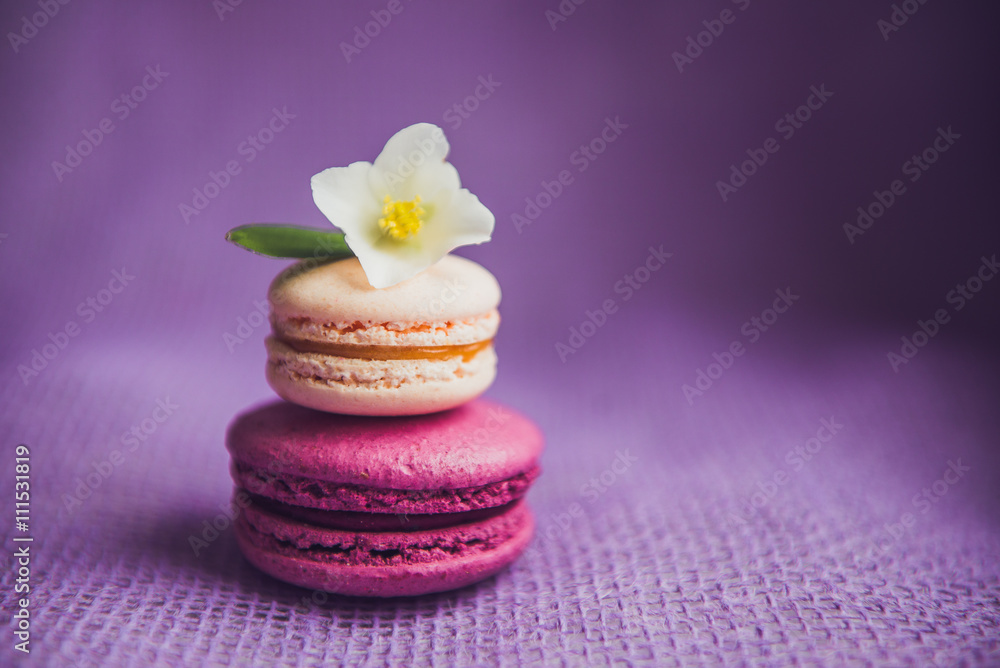 French macarons with white flowers French macarons with white flowers