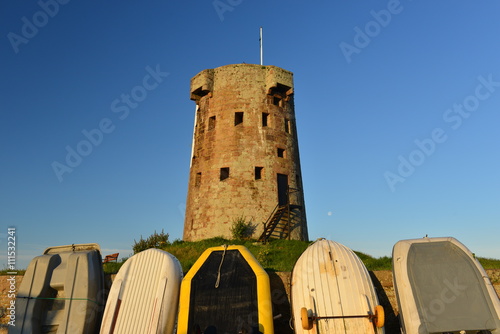 La Hocq, Jersey, U.K.  Wide angle image of an uninhabited 19th century coastal tower. photo