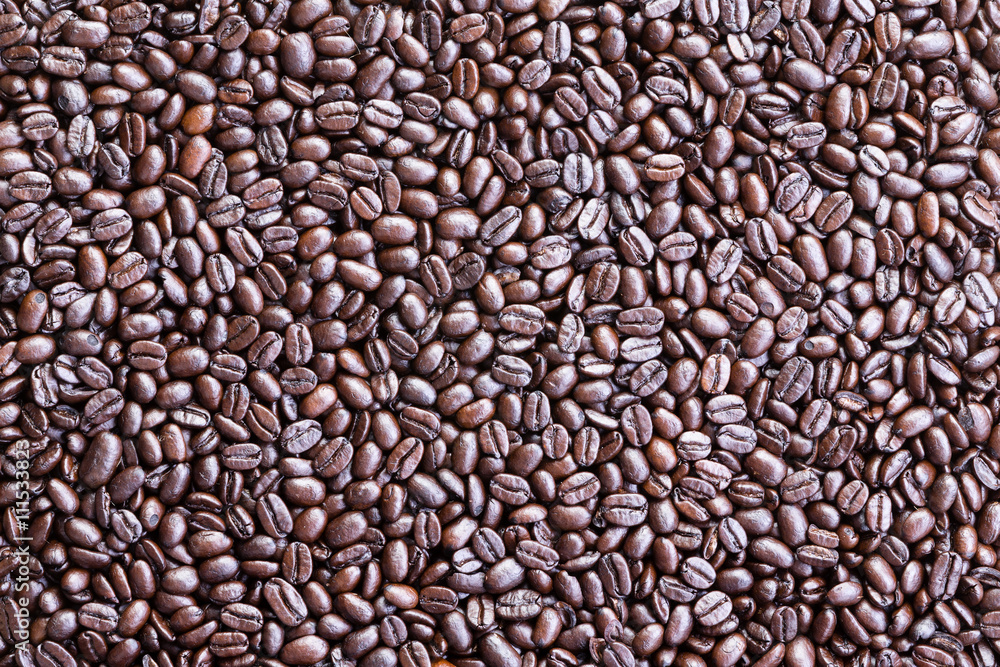 Background made from overhead view of coffee beans Background made from overhead view of coffee beans