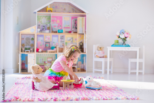 Print op canvas Kids playing with stuffed animals and doll house