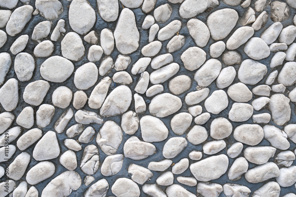 White pebble stone cemented floor, texture background White pebble stone cemented floor, texture background