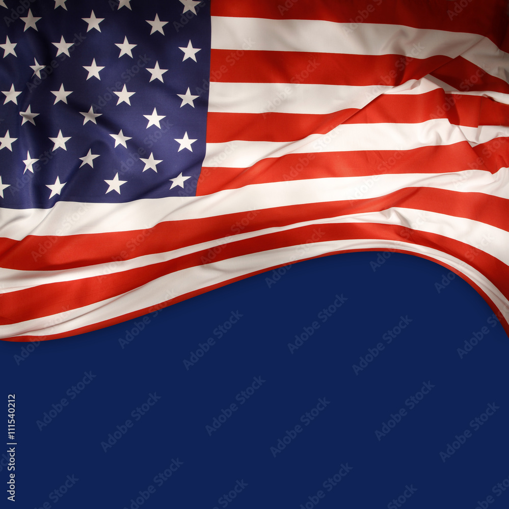 Fototapeta premium American flag on blue. Copy space