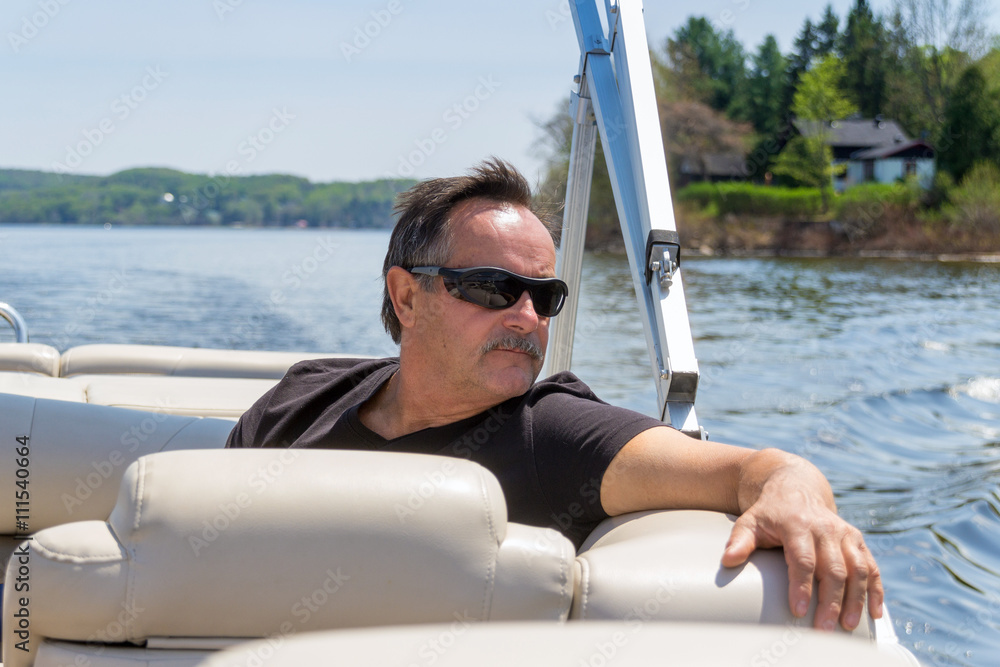 men 60 years old relaxing on a boat at summer